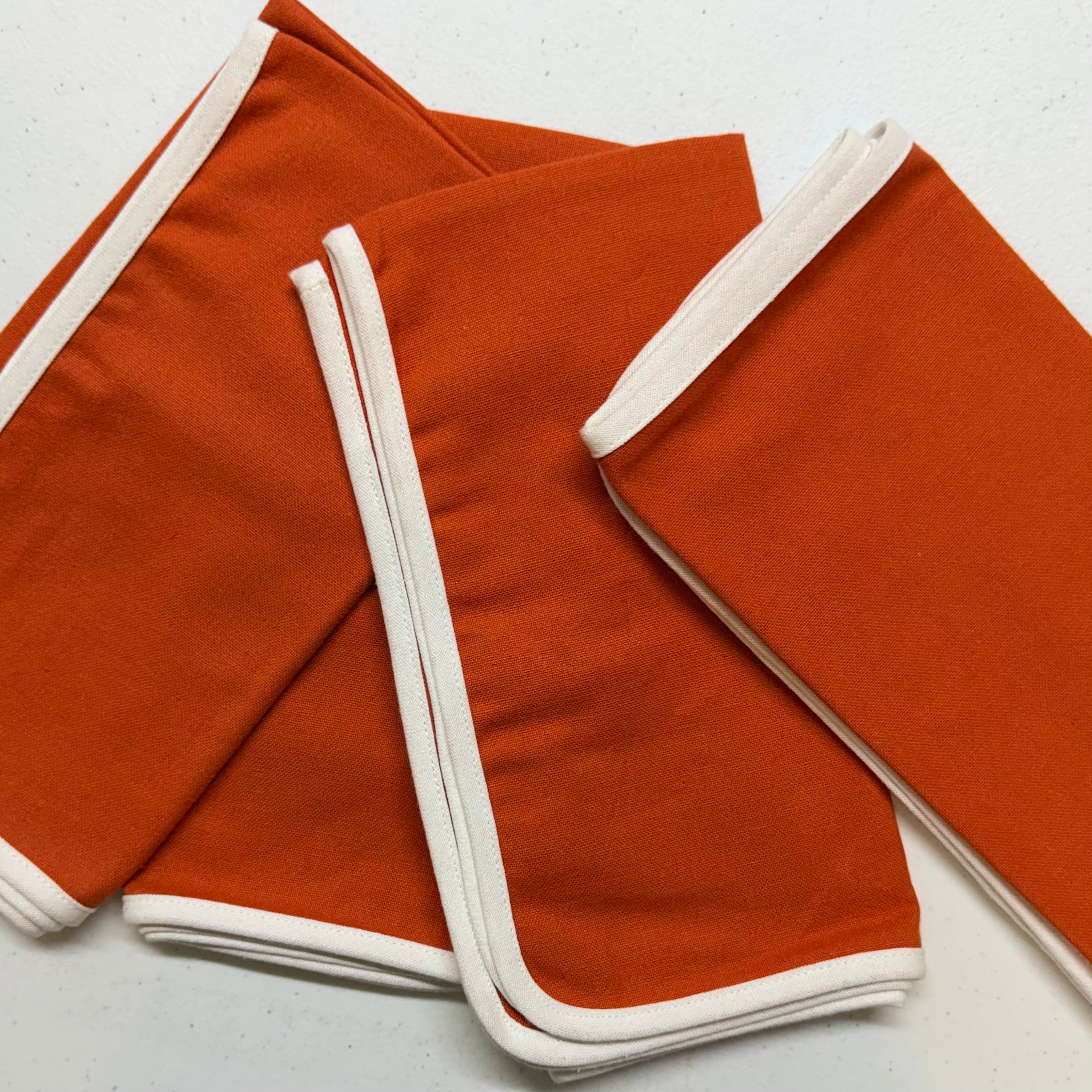 Orange with White Edge Cloth Napkins $30